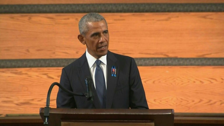 SOUNDBITEFormer US president Barack Obama receives a standing ovation after condemning Republican attempts at voter suppression during a eulogy at the funeral service of civil rights leader and Congressman John Lewis in Atlanta. "Even as we sit here, ther