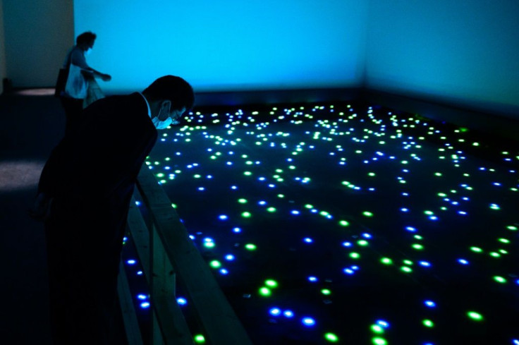 To view pieces like this work by artist Tatsuo Miyajima, visitors will have to reserve in advance and wear a face mask