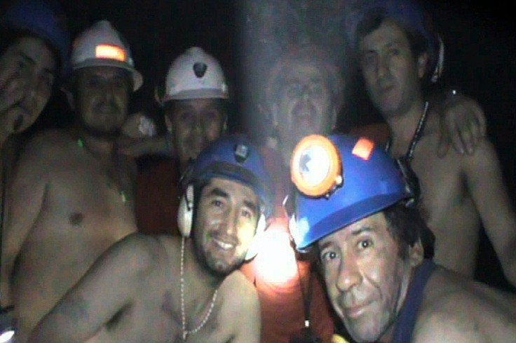 In this handout file photo released by Chile's mining ministry and taken on September 17, 2010, trapped Chilean miners pose inside the San Jose mine during their harrowing ordeal