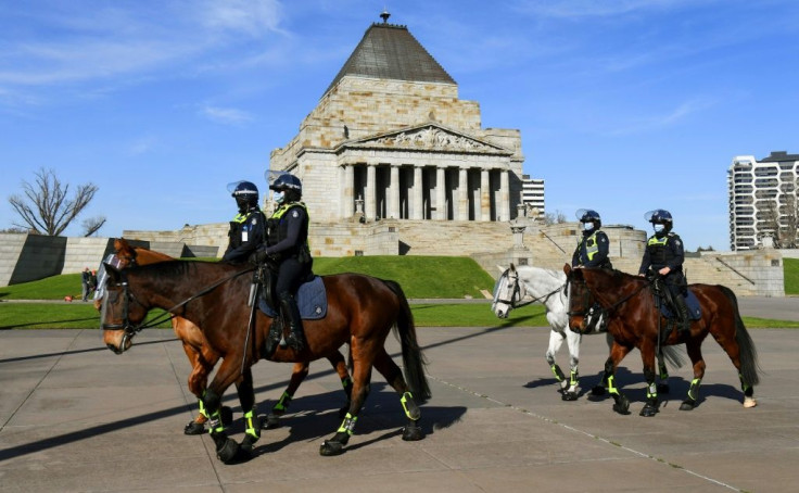 Police patrol Melbourne's Shrine of Remembrance to enforce rules requiring people wear masks