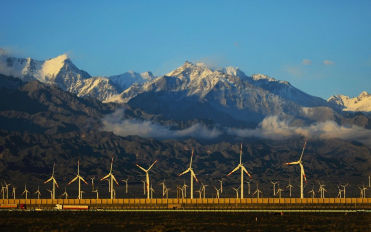 Wind turbines are seen in 2018 in the Dabancheng district in Urumqi in China's northwestern Xinjiang region, where critics say that development has been dominated by China's Han majority