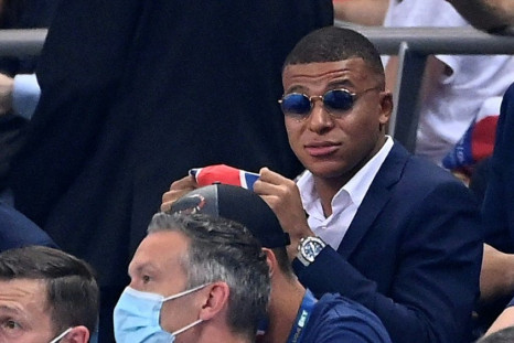 A dapper Kylian Mbappe watches Friday's French League Cup final from the stand -- the striker missed PSG's clash with Lyon because of an ankle injury