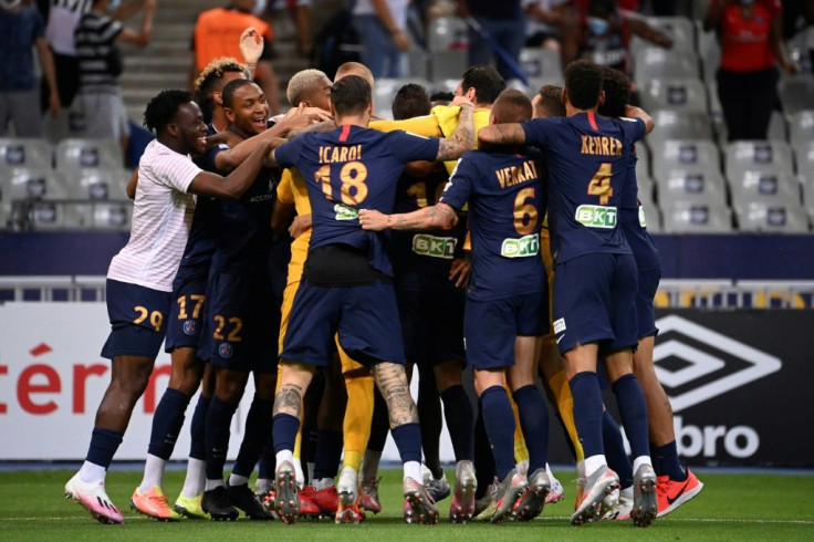 Paris Saint-Germain players celebrate after beating Lyon on penalties in the French League Cup final