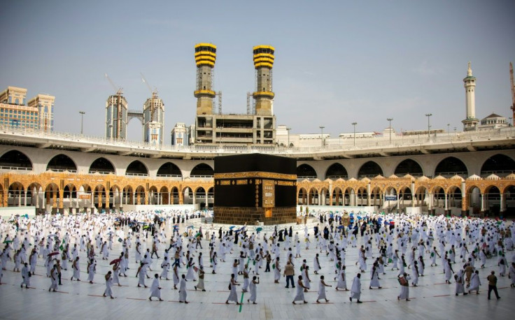 Pilgrims circulate around Kaaba in Mecca's Grand Mosque on Friday, in reduced numbers because of coronavirus