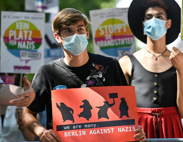 As politicians slammed the rally, a small number of counter-protesters gathered, one holding a sign reading "we are many. Berlin against Nazis"