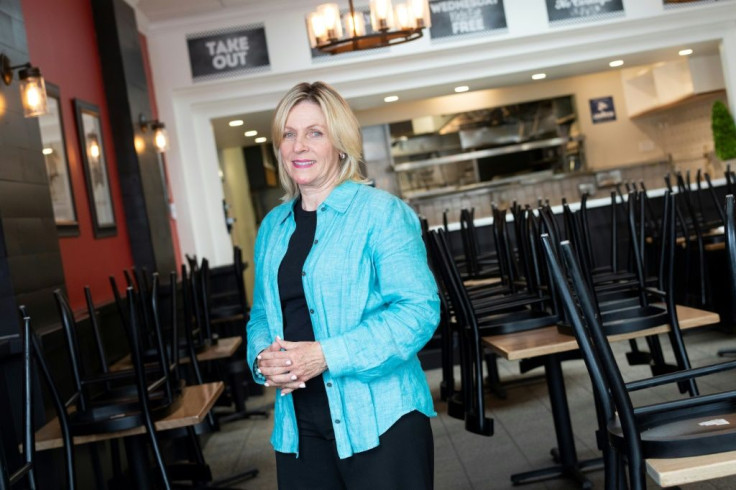 Madelyn Alfano owner of Maria's Italian Kitchen poses inside one of two restaurants she was forced to shut down because of the Covid-19 pandemic, on July 28, 2020, in Santa Monica, California.