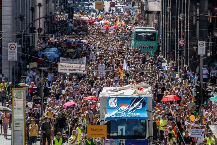 Thousands protested in Berlin  urging "a day of freedom" from restrictions, with some demonstrators dubbing the pandemic "the biggest conspiracy theory"