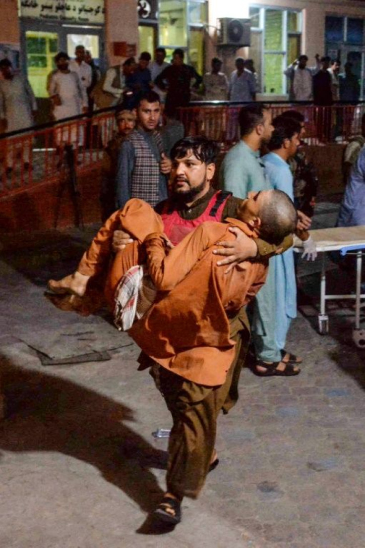 A man wounded in the bomb blast attack on a prison in Jalalabad city on August 2, 2020 is carried to the hospital