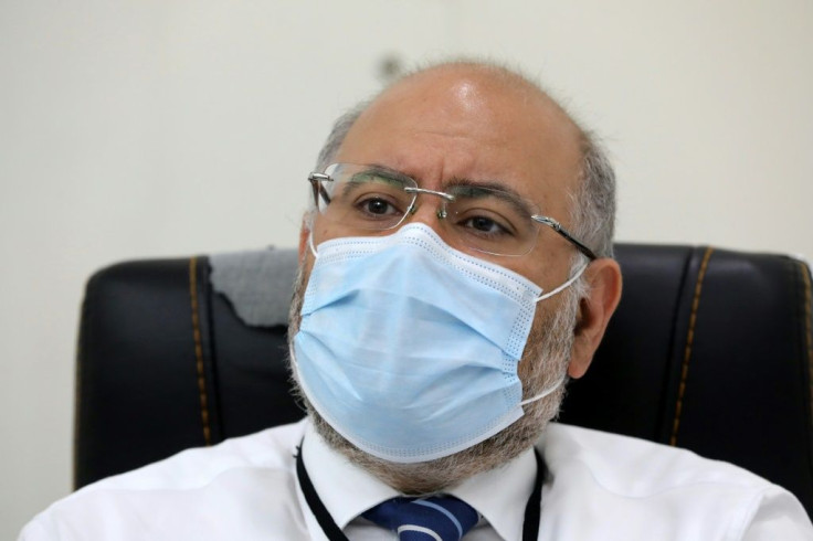 The director of Beirut's Rafic Hariri University Hospital, Firass Abiad, speaks during an interview with AFP at his office inside the coronavirus department