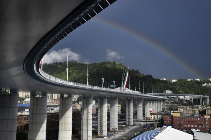 A rainbow appears above the new San Giorgio bridge on its inauguration. The high-tech structure will have four maintenance robots running along its length to spot weathering or erosion