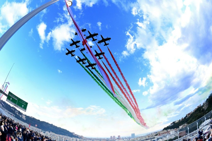 A wide angle view shows the Italian Air Force acrobatic unit Frecce Tricolori performing over the new San Giorgio bridge on its inauguration day.