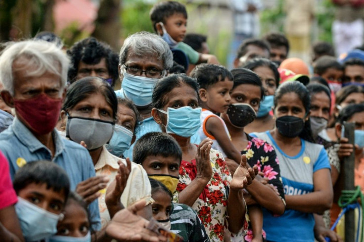 Supporters of the Rajapaksas' party attend a campaign rally ahead of the upcoming parliamentary elections, near the capital Colombo