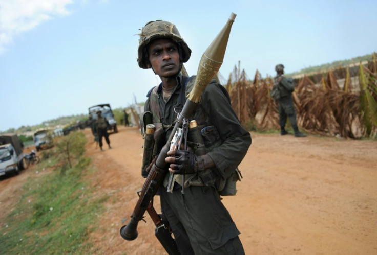 Sri Lankan soldiers stand guard in 2009, towards the end of the decades-old separatist conflict which the Rajapaksas are renowned for ending