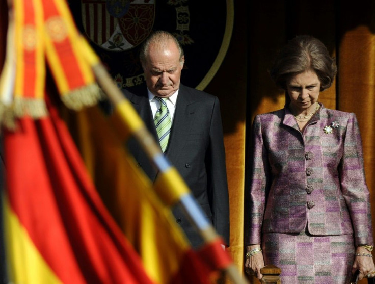 Juan Carlos and his wife Sofia attend a military parade in 2009