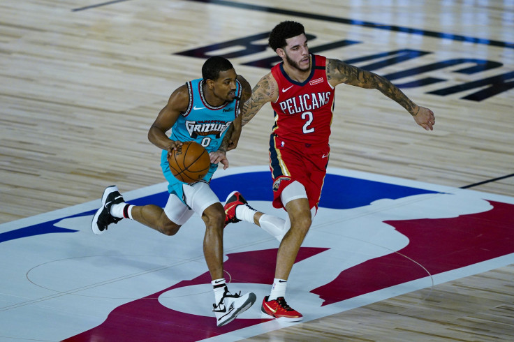 De'Anthony Melton #0 of the Memphis Grizzlies brings the ball up court under pressure from Lonzo Ball #2 of the New Orleans Pelicans