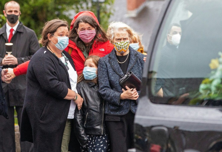 The funeral cortege led by Hume's wife, Pat (right), arrived at the cathedral on the eve of the service