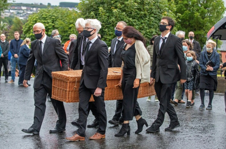 The wicker casket containing Hume's remains was brought into St Eugene's Cathedral in Londonderry on Tuesday evening