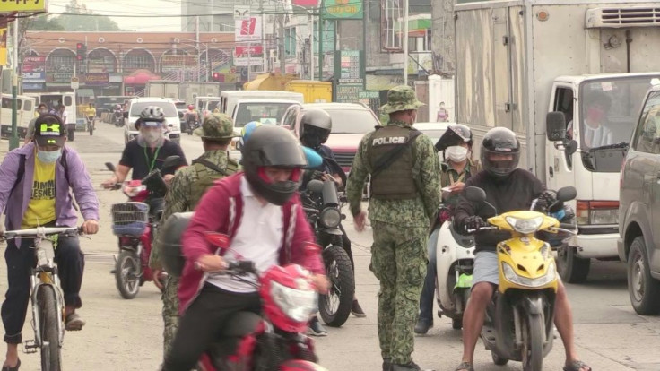 Philippine authorities set up checkpoints, cancel domestic flights, and order millions of people to stay home again as it reimposes stricter quarantine restrictions in Manila and its surrounding areas amid rising spread of the coronavirus. Police check ID