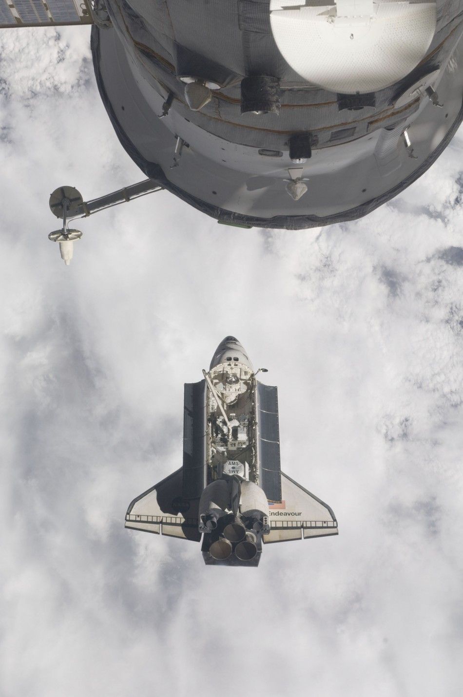 Handout photo shows the space shuttle Endeavour with the ISS in the foreground as the two spacecraft made their relative approach for docking.