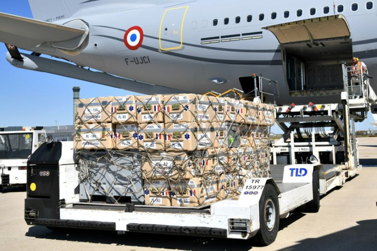 Medical and sanitary supplies are loaded aboard a Airbus A330, at Roissy airport, near Paris, as France sends search and rescue experts aboard three military planes loaded with a mobile clinic and tonnes of medical equipment to Beirut