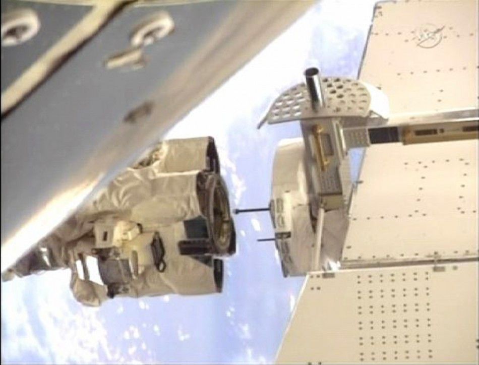The International Space Station039s robot arm closes in on the grapple pin on the Alpha Magnetic Spectrometer. 19052011