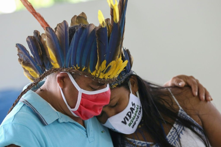 Indigenous people from the Parque das Tribos community mourn at the funeral of chief Messias, 53, of the Kokama tribe, who died of COVID-19 in May 2020 -- the community was the first indigenous tribe in Brazil to confirm a coronavirus death