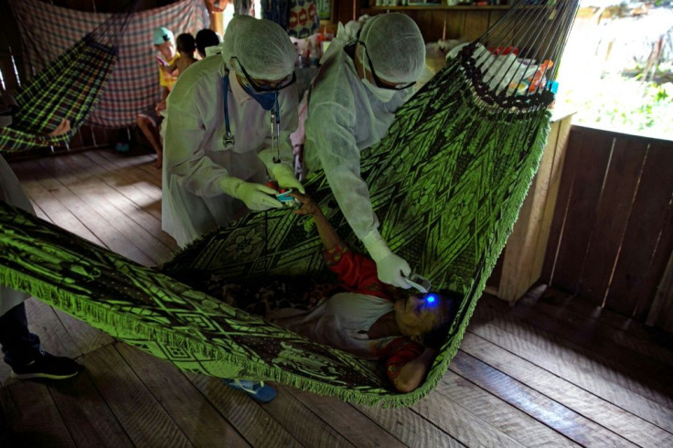 Government health workers visit riverside communities in Brazil's Marajoara region at the mouth of the Amazon to test residents for COVID-19