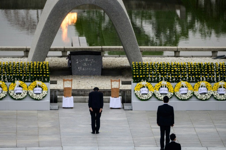 Japanese Prime Minister Shinzo Abe bows in front of the Cenotaph after delivering a speech during the 75th anniversary service for atomic bomb victims at the Peace Memorial Park in Hiroshima