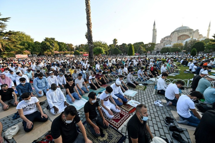 Worshippers take part in the Eid al-Adha prayers outside Hagia Sophia in Istanbul