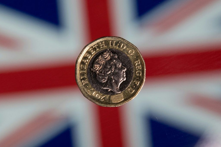 The British pound shot higher Thursday after the Bank of England upgraded its economic forecast