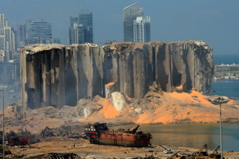The damaged grain silo and a burnt ship at Beirut's harbour after a powerful explosion tore through Lebanon's capital