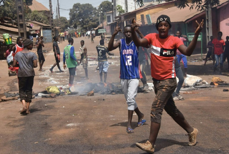 Violent protests have erupted in Conakry and other cities over suspicions that Conde plans to run again