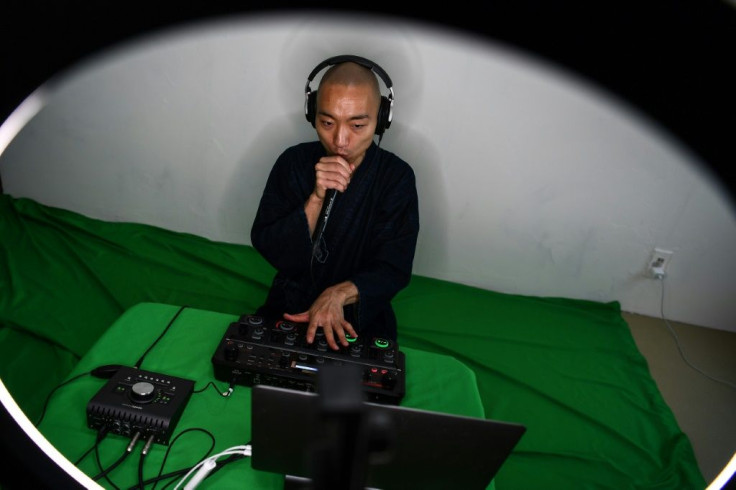 Yogetse Akasaka, a Buddhist monk and beatbox musician, presents a live stream performance at his home in Tokyo