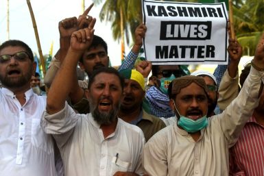 Protesters in Karachi shout slogans during a rally to show solidarity with people of Indian-administered Kashmir on August 5