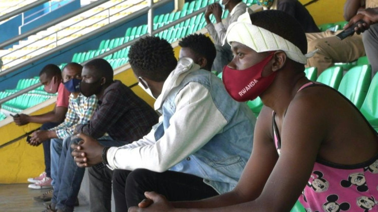 Rwandans caught breaking curfew or not wearing masks are being sent to stadiums in droves for all-night lectures on the dangers of coronavirus.
