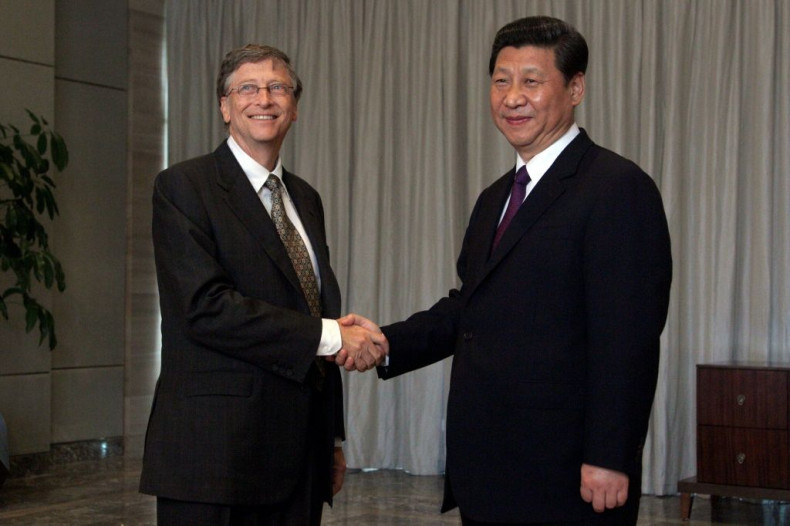 Microsoft founder Bill Gates is pictured with China's President Xi Jinping during a conference on the southern Chinese resort island of Hainan on April 8, 2013