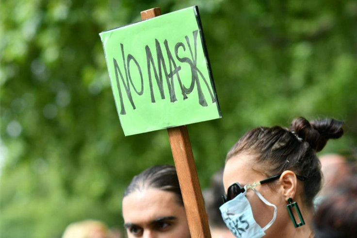 Dozens gathered in London to protest the face mask requirement in England's shops and supermarkets