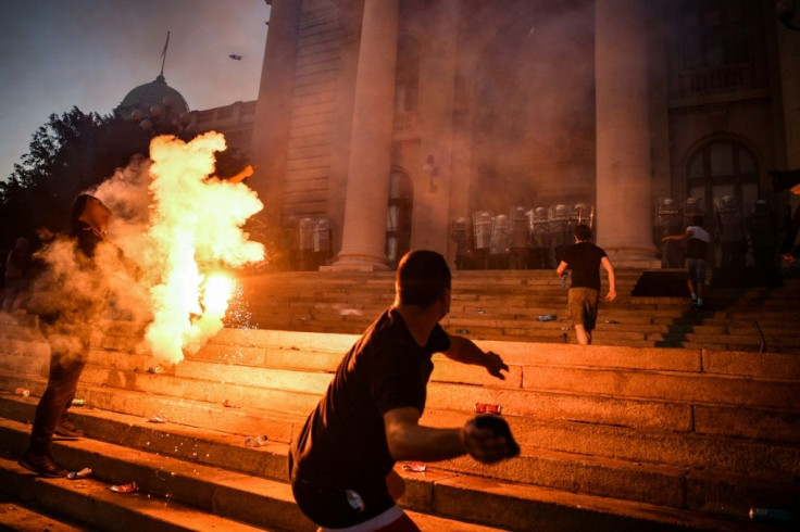 Protesters clashed with police during a demonstration in Belgrade against a weekend curfew to combat a resurgence of COVID-19 infections