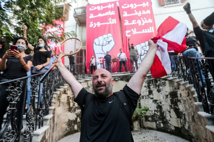 Lebanese protesters celebrate storming the Ministry of Foreign Affairs in Beirut
