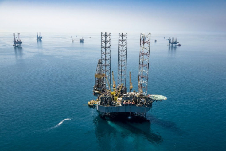 A handout picture provided Saudi Aramco shows its rigs in HSBH field north of Dhahran in 2018