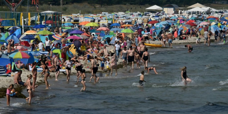 Despite COVID-19 fears, people enjoy warm summer weather at a beach near the Baltic Sea village of Binz, northern Germany