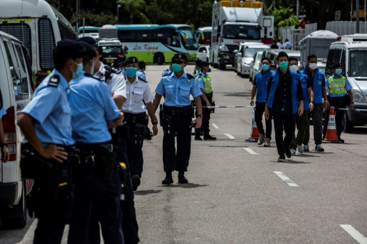 Police in Hong Kong cordoned off the street outside the Next Media offices after the arrest of media tycoon Jimmy Lai
