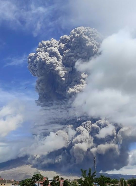 Mount Sinabung emits ash and smoke into the air