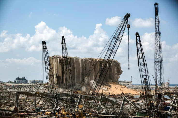 Cranes at the port of Lebanon's capital Beirut stand before the grain silos destroyed in the colossal explosion