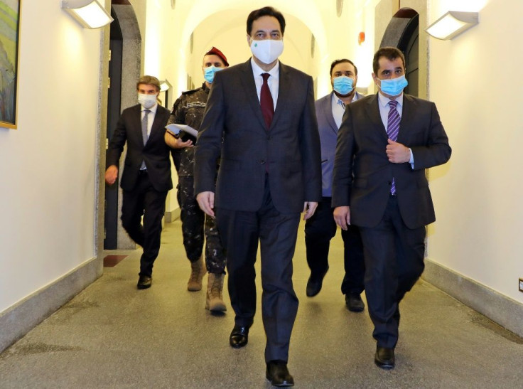 Diab pictured in June wearing a face mask due to the COVID-19 pandemic ahead of an emergency cabinet session