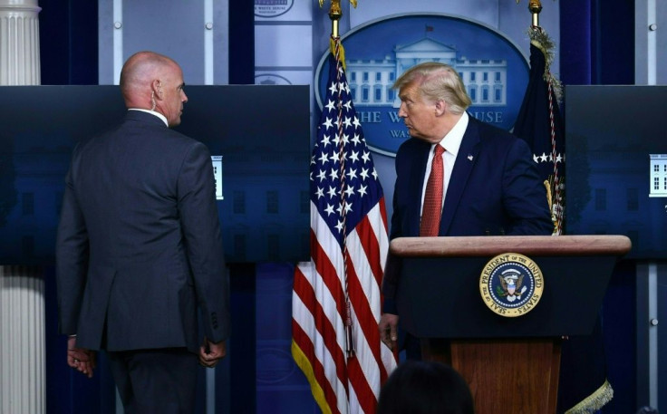 US President Donald Trump was abruptly ushered out of a press conference by secret service agents, and later said that a person had been shot outside the White House