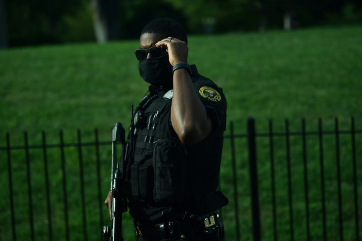 A member of the US Secret Service's counter assault team stands outside the Brady Briefing Room of the White House on August 10, 2020