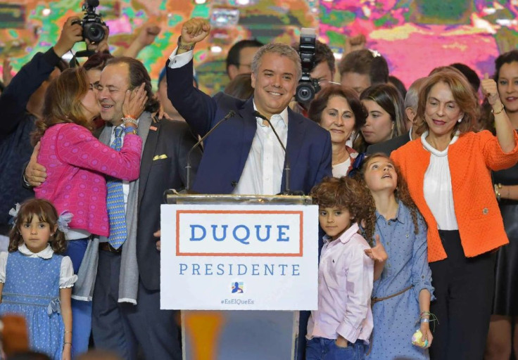 Colombian President Ivan Duque (center) -- seen here celebrating his election victory in June 2018 alongside his family -- is now under investigation for alleged campaign finance violations