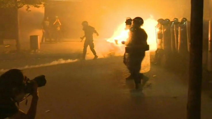 Clashes erupt between Lebanese protesters and security forces near the parliament in downtown Beirut.