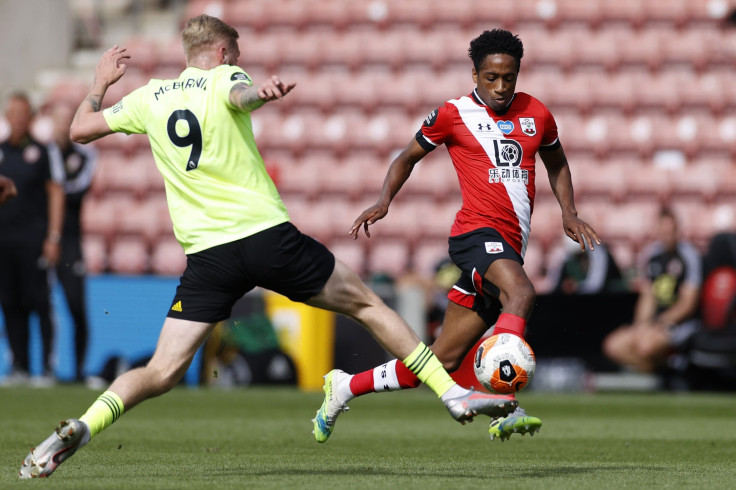 Kyle Walker-Peters of Southampton battles for possession with Oliver McBurnie of Sheffield United